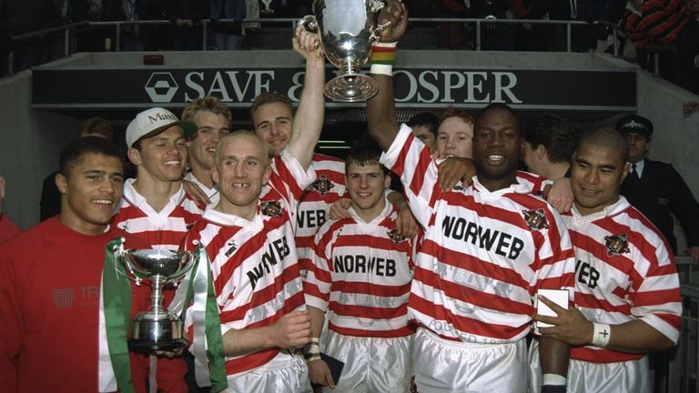 11 May 1996: Shaun Edwards and Martin Offiah of Wigan celebrate with their team by holding the trophy aloft after the Save and Prosper Middlesex Sevens match at Twickenham, London. \ Mandatory Credit: Dave Rogers/Allsport