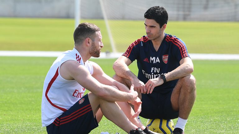  Shkodran Mustafi of Arsenal chats to Arsenal Head Coach Mikel Arteta during the Arsenal Training Session on February 08, 2020 in Dubai, United Arab Emirates. 