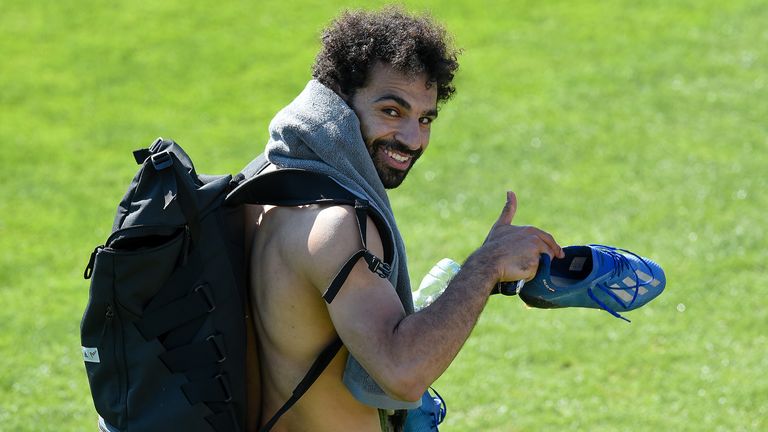 Mohamed Salah gestures as Liverpool return to training at Melwood