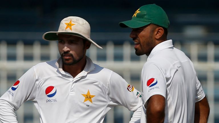 SHARJAH, UNITED ARAB EMIRATES - NOVEMBER 03: Mohammad Amir (L) and Wahab Riaz of Pakistan on day five of the third test between Pakistan and West Indies at Sharjah Cricket Stadium on November 3, 2016 in Sharjah, United Arab Emirates. (Photo by Chris Whiteoak/Getty Images)