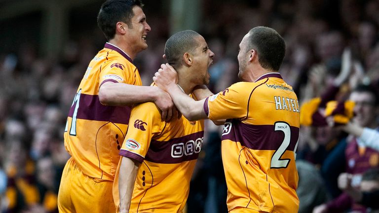 Giles Coke (centre) roars with delight alongside John Sutton (left) and Tom Hateley after netting for Motherwell