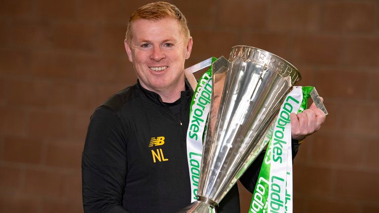 Neil Lennon is pictured with the Ladbrokes Premiership trophy as Celtic are announced champions