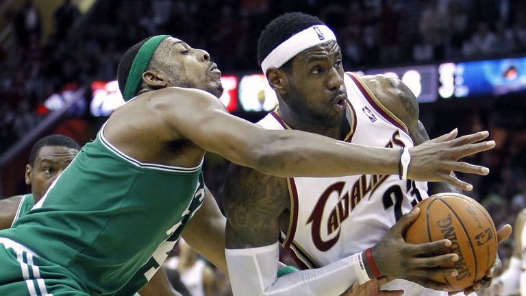 LeBron James drives by Paul Pierce during a Cavaliers-Celtics game