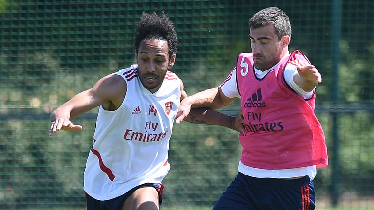 Pierre-Emerick Aubameyang and Sokratis take part in a training session on Saturday