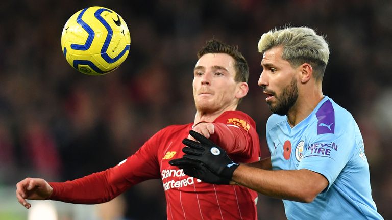 Andy Robertson and Sergio Aguero compete for the ball 