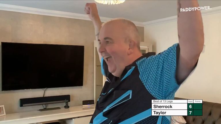 Phil Taylor celebrates after beating Fallon Sherrock