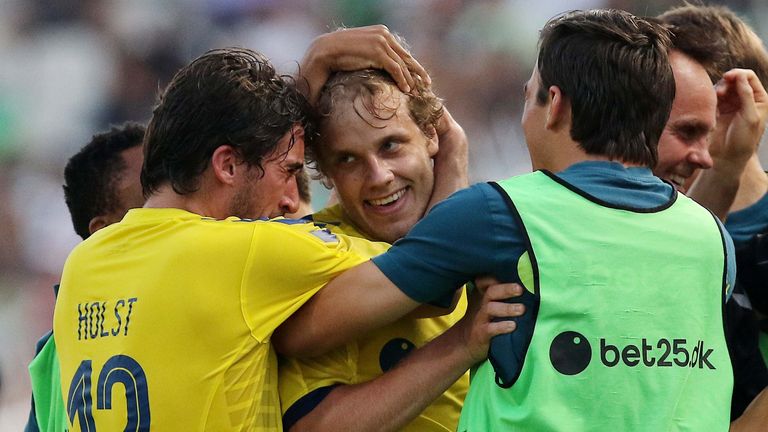 Teemu Pukki is congratulated by his Brondby team-mates