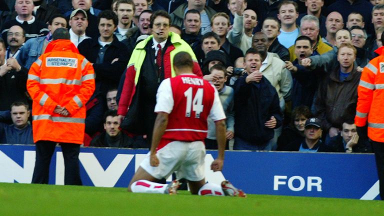 Henry celebrates in front of Tottenham fans after his solo goal