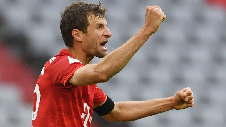 Thomas Muller celebrates scoring Bayern Munich's second goal against Frankfurt