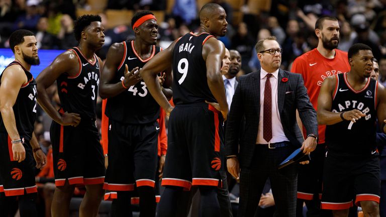 Nick Nurse pictured with his Raptors players during a timeout