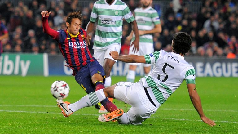 BARCELONA, SPAIN - DECEMBER 11:  Neymar (2.R) of FC Barcelona beats Virgil van Dijk of Celtic FC to score his team's 4th goal during the UEFA Champions League, Group H match between FC Barcelona and Celtic FC at the Camp Nou Stadium on December 11, 2013 in Barcelona, Spain.  (Photo by Denis Doyle/Getty Images)