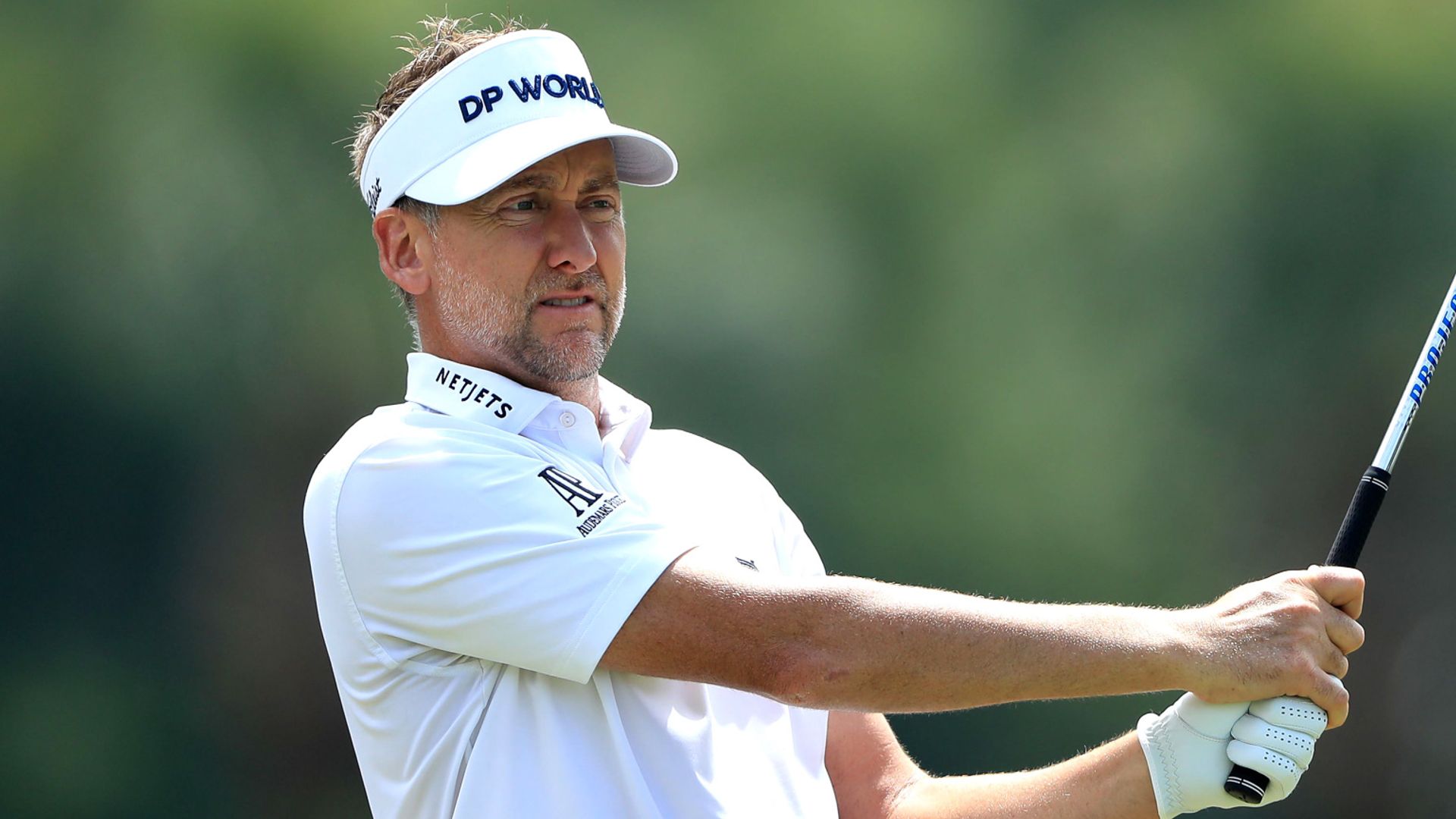 Poulter leads, McIlroy struggles