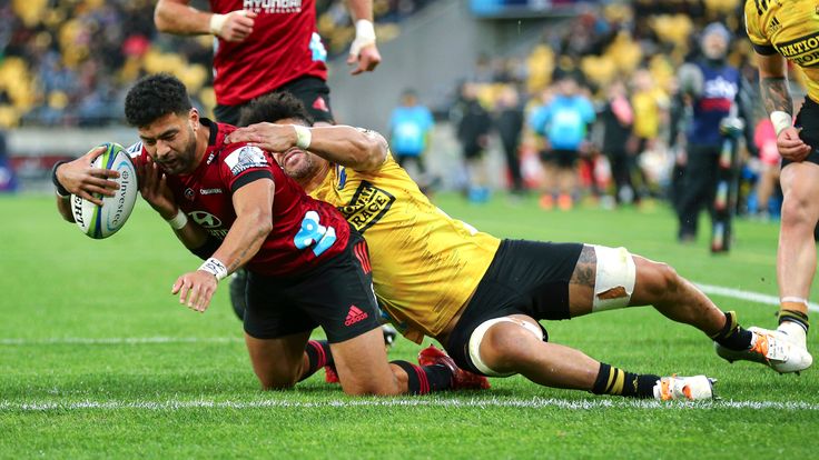 WELLINGTON, NEW ZEALAND - JUNE 21: Richie Mo'unga of the Crusaders scores a try in the tackle of Ardie Savea of the Hurricanes during the round 2 Super Rugby Aotearoa match between the Hurricanes and the Crusaders at Sky Stadium on June 21, 2020 in Wellington, New Zealand. (Photo by Hagen Hopkins/Getty Images)