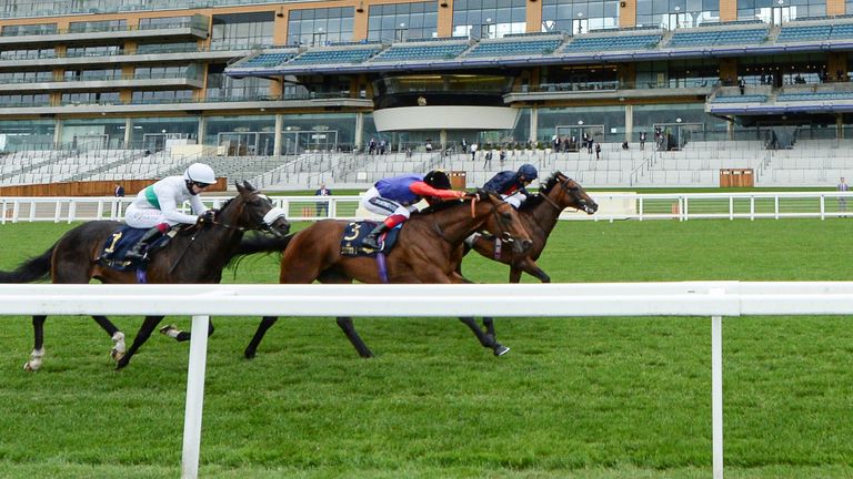 Russian Emperor ridden by Ryan Moore (right) wins the Hampton Court Stakes from First Receiver