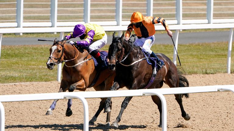 Zodiakos (orange), trained by Roger Fell and ridden by James Sullivan, on their way to winning the Betway Welcome Back British Racing Handicap at Newcastle