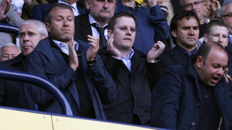 Chelsea's Russian owner Roman Abramovich (L) attends the match with Chelsea share-holder Bruce Buck (2nd R) and Chelsea chief executive Peter Kenyon (R) during their Premier League football match at White Hart Lane in London, England on March 21, 2009. AFP PHOTO/IAN KINGTON - FOR EDITORIAL USE ONLY Additional licence required for any commercial/promotional use or use on TV or internet (except identical online version of newspaper) of Premier League/Football League photos. Tel DataCo +44 207 2981