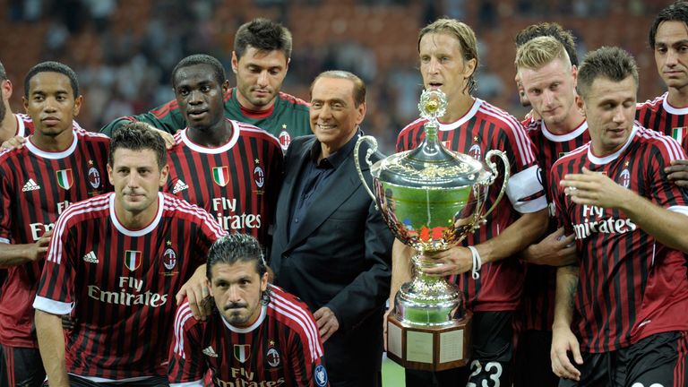 Silvio Berlusconi and the AC Milan squad during the Berlusconi Trophy match between AC Milan and Juventus FC at Giuseppe Meazza Stadium on August 21, 2011 in Milan, Italy.