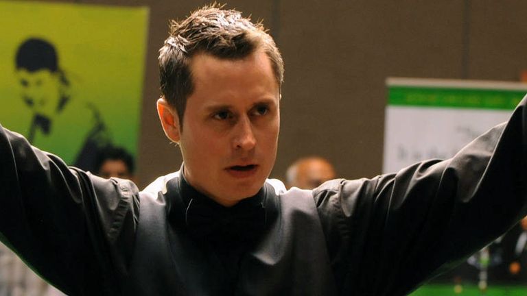 Alfie Burden of England gestures after winning the men's singles title of the World Snooker championship held at the Hyderabad International Convention Center