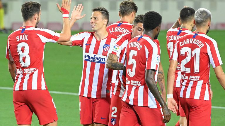 Saul Niguez celebrates scoring his second penalty 