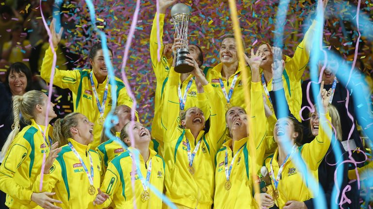 The Australian team are covered with confetti as they celebrate with the trophy after victory during the 2015 Netball World Cup Gold Medal match between Australia and New Zealand at Allphones Arena on August 16, 2015 in Sydney, Australia.