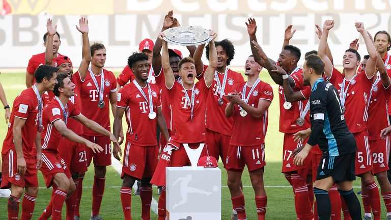 Bayern Munich lifted the Bundesliga trophy inside the empty Volkswagen Arena