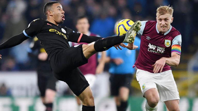 BURNLEY, ENGLAND - DECEMBER 03: Gabriel Jesus of Manchester City clears the ball while under pressure from Ben Mee of Burnley during the Premier League match between Burnley FC and Manchester City at Turf Moor on December 03, 2019 in Burnley, United Kingdom. (Photo by Stu Forster/Getty Images)