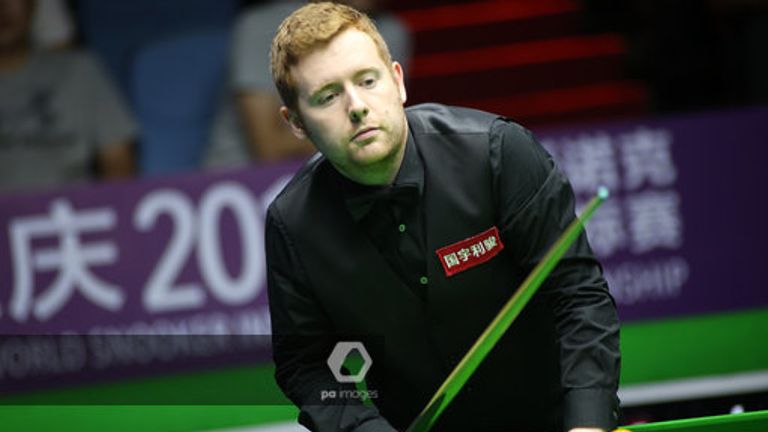 Ben Woollaston of England considers a shot to Mark Anthony Selby of England in the second round match during the 2019 World Snooker International Championship in Daqing city, northeast China's Heilongjiang province, 6 August 2019