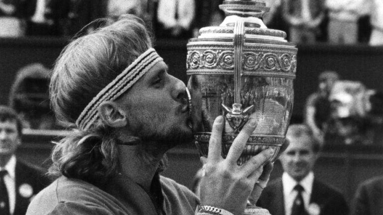 Bjorn Borg of Sweden kisses the men&#39;s singles trophy after winning it for the fourth successive year at the Wimbledon Tennis Championships, beating Roscoe Tanner of the USA. 