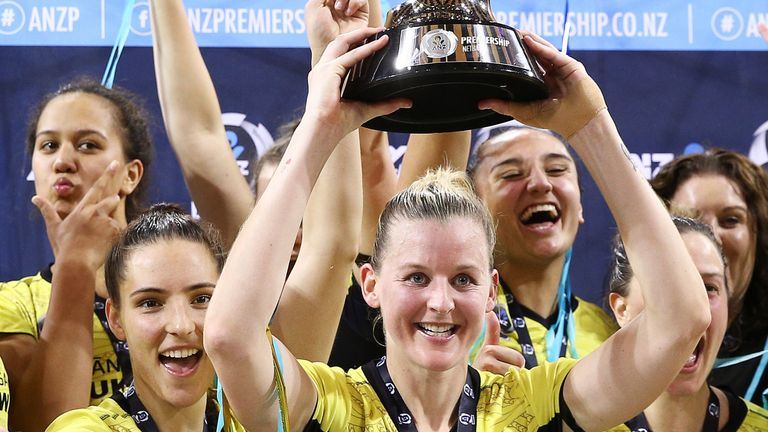 Pulse players celebrate with the ANZ Premiership trophy after winning the ANZ Premiership Netball Final 