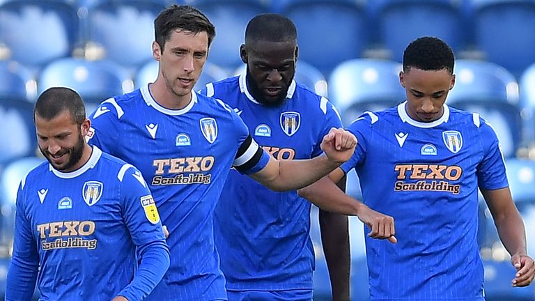 Cohen Bramall is congratulated by team-mates after his free-kick proved enough for Colchester to beat Exeter 1-0