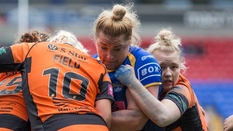Picture by Isabel Pearce/SWpix.com - 27/07/2019 - Rugby League - Coral Women's Challenge Cup Final - Leeds Rhinos v Castleford Tigers - University of Bolton Stadium, Bolton, England - Danika Prim of Leeds is tackled by Grace Field and Georgia Roche of Castleford.