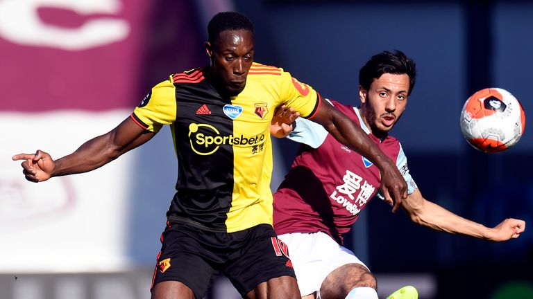 Watford's Danny Welbeck and Burnley's Dwight McNeil battle for the ball