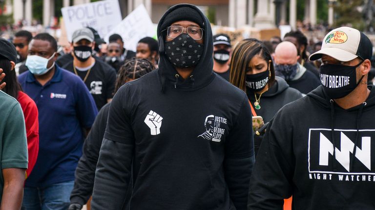 Denver Broncos linebacker Von Miller (centre) leads a crowd on a march at a protest on Saturday in Denver, Colorado