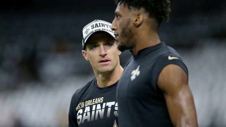 Drew Brees #9 and Michael Thomas #13 of the New Orleans Saints talk prior to the game against the Carolina Panthers at Mercedes Benz Superdome on November 24, 2019 in New Orleans, Louisiana