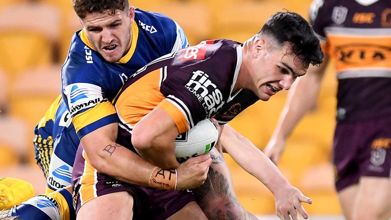 BRISBANE, AUSTRALIA - MAY 28: Herbie Farnworth of the Broncos attempts to break away from the defence during the round three NRL match between the Brisbane Broncos and the Parramatta Eels at Suncorp Stadium on May 28, 2020 in Brisbane, Australia. (Photo by Bradley Kanaris/Getty Images)