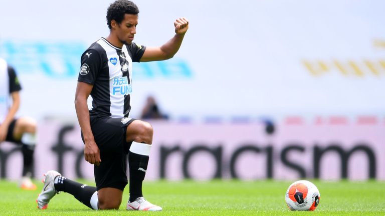 Newcastle United&#39;s English midfielder Isaac Hayden gestures as he takes a knee during the English Premier League football match between Newcastle United and Sheffield United at St James&#39; Park in Newcastle-upon-Tyne, north east England on June 21, 2020.
