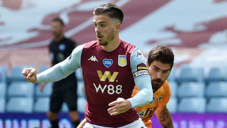 Aston Villa midfielder Jack Grealish tries to escape the attentions of Wolves' Ruben Neves