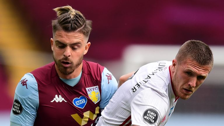 Aston Villa's Jack Grealish and Sheffield United's John Lundstram battle for the ball