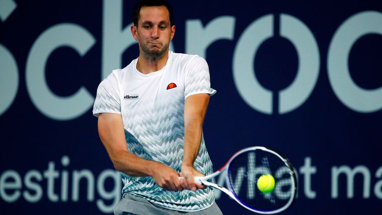 James Ward plays a backhand in his match against Liam Broady on day 2 of Schroders Battle of the Brits at the National Tennis Centre on June 24, 2020 in London, England.