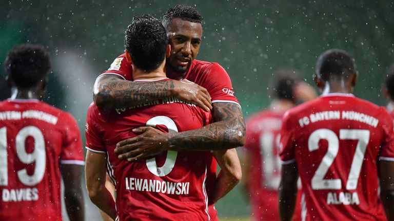 Jerome Boateng celebrates with Lewandowski after the deadlock was broken