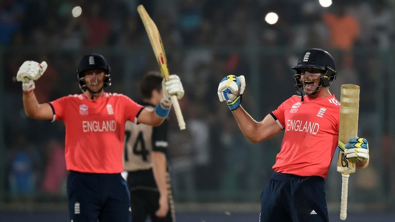 England's Joe Root (L) and Jos Buttler celebrate after winning the World T20 cricket tournament semi-final match between England and New Zealand at the Feroz Shah Kotla cricket ground in New Delhi on March 30, 2016. 