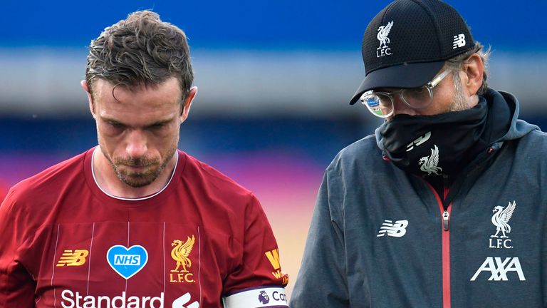 Jurgen Klopp talks to Jordan Henderson after the Merseyside derby on Sunday