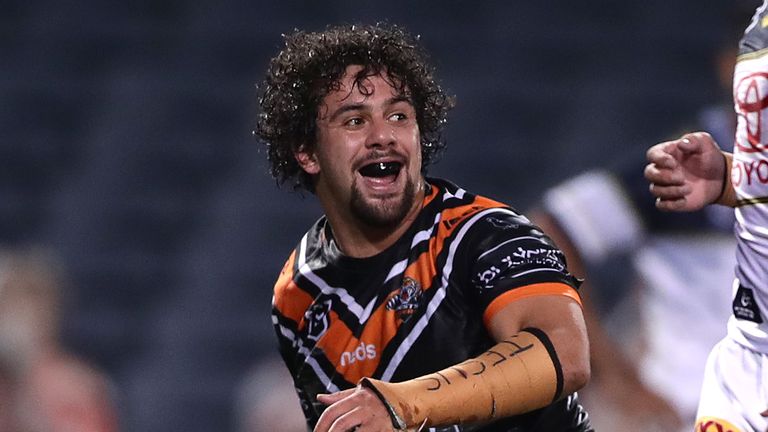 SYDNEY, AUSTRALIA - JUNE 20: Josh Aloiai of the Tigers celebrates after scoring a try during the round six NRL match between the Wests Tigers and the North Queensland Cowboys at Campbelltown Stadium on June 20, 2020 in Sydney, Australia. (Photo by Mark Metcalfe/Getty Images)