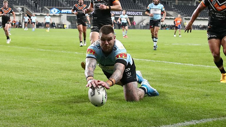 SYDNEY, AUSTRALIA - MAY 30: Josh Dugan of the Sharks scores a try during the round three NRL match between the Cronulla Sharks and the Wests Tigers at Bankwest Stadium on May 30, 2020 in Sydney, Australia. (Photo by Cameron Spencer/Getty Images)
