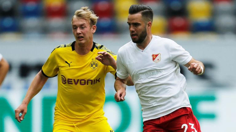 Borussia Dortmund midfielder Julian Brandt battles for possession Fortuna Dusseldorf's Niko Giesselmann