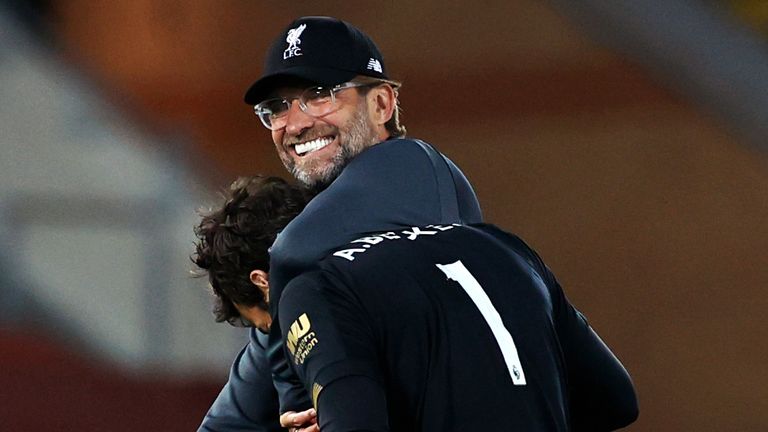 Liverpool manager Jurgen Klopp celebrates victory over Crystal Palace with goalkeeper Alisson 