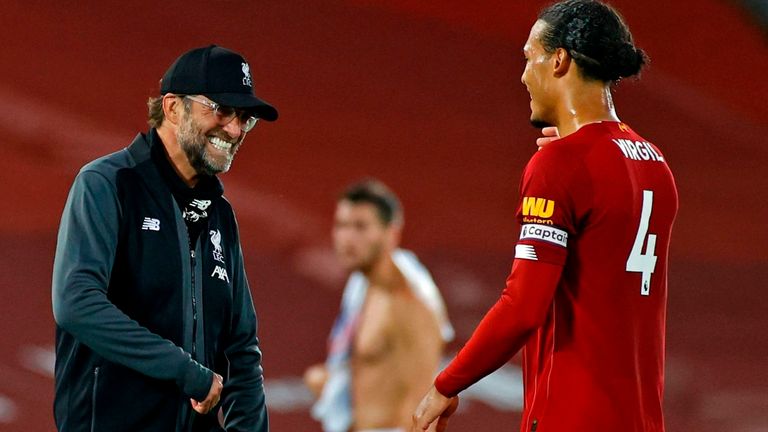 Liverpool's Jurgen Klopp and Virgil van Dijk react after victory over Crystal Palace put them on the brink of glory