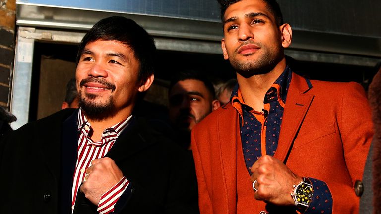 Manny Pacquiao and Amir Khan pose after holding discussions about the possibility of a future fight, at Fitzroy Lodge Amateur Boxing Club on January 23, 2015 in London, England.
