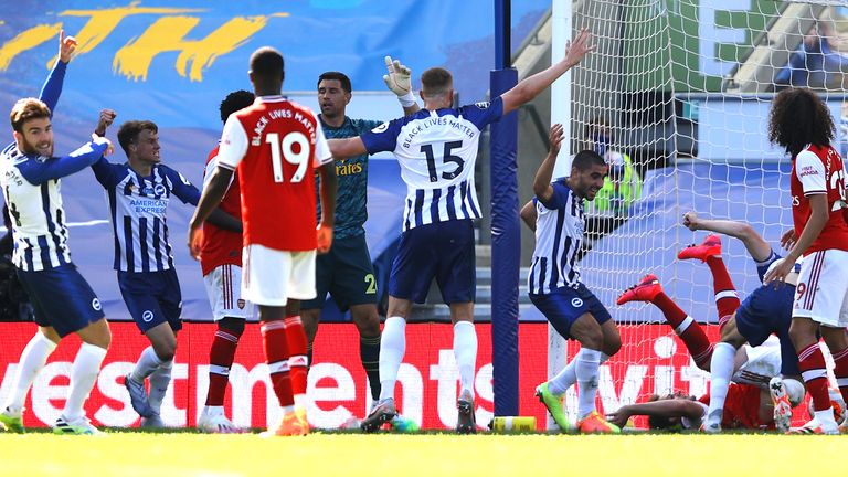 Lewis Dunk bundles the ball over the line to score Brighton's equaliser against Arsenal