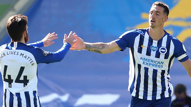 Lewis Dunk celebrates after scoring Brighton's equaliser against Arsenal